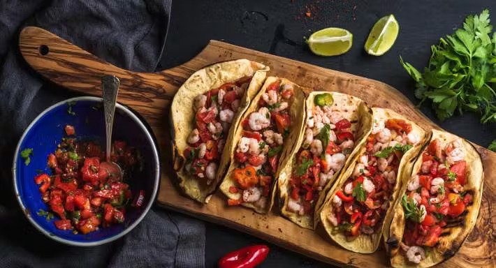 Mexican tacos with salsa and coriander